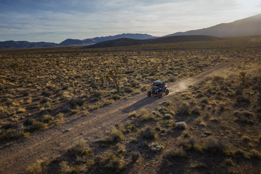 Las Vegas Sunset Tour: 7 Essential RZR Experience Tips 2 Las Vegas sunset tour RZR following a desert trail below mountain ridges