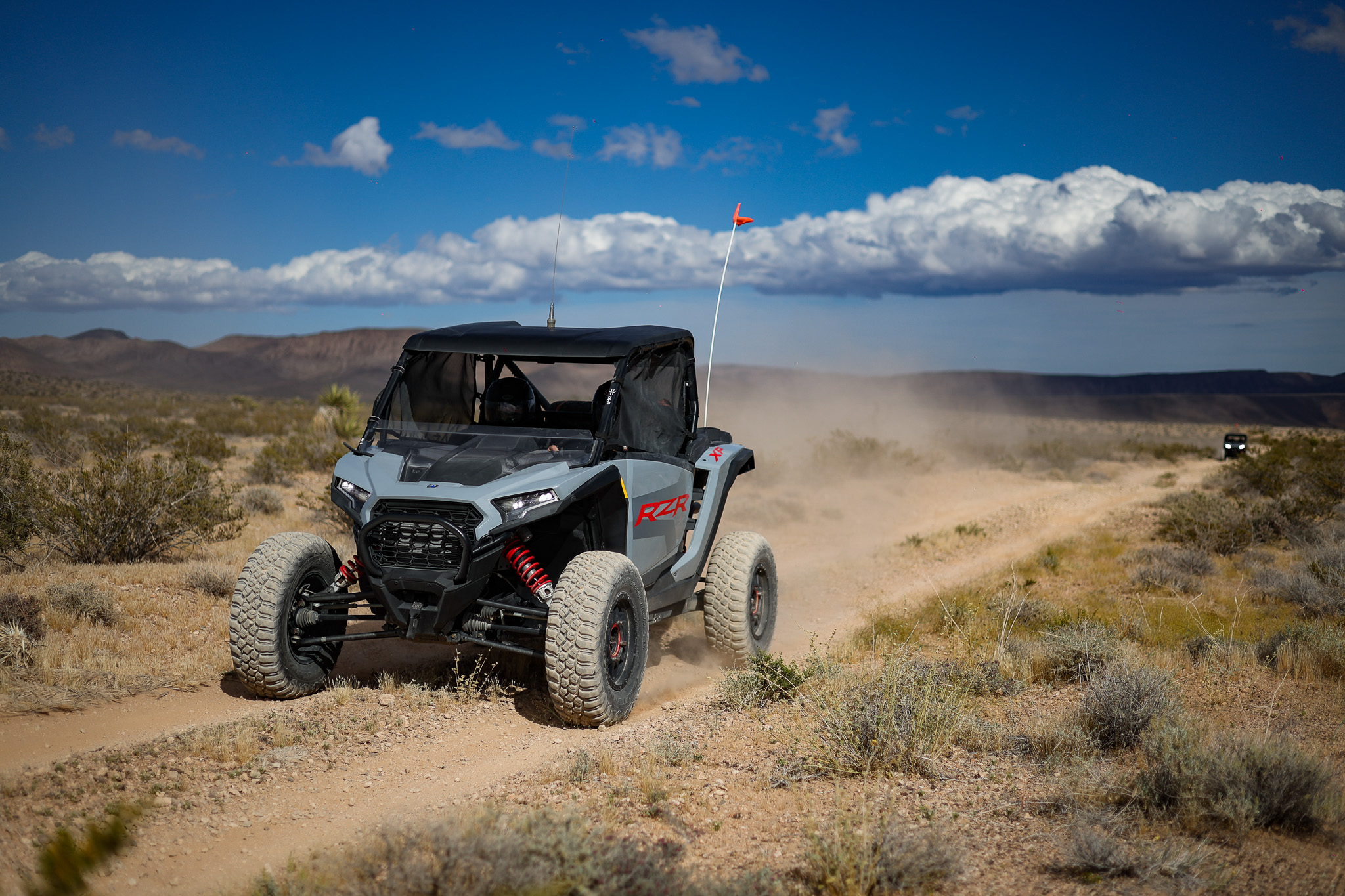 Las Vegas Desert Adventures: 5 Ways to Explore the Mojave 1 Las Vegas desert adventures in a Polaris RZR on a dusty trail
