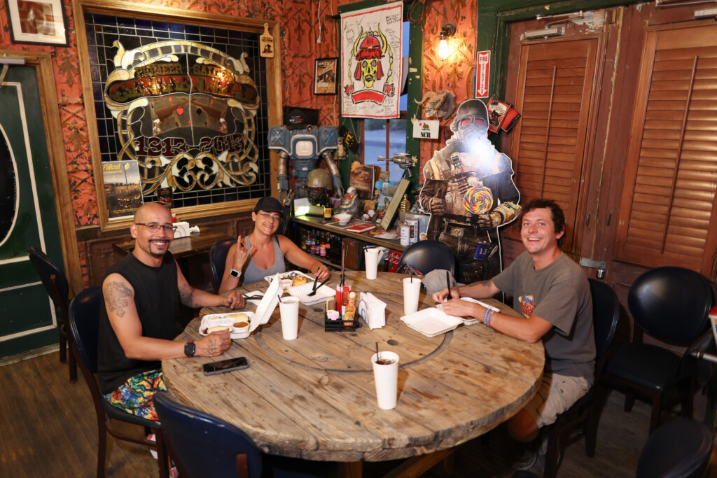 Guests seated around a table inside the Pioneer Saloon dining area