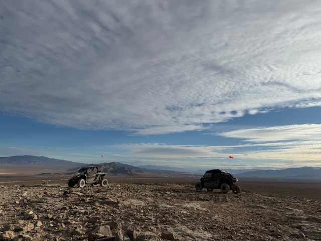 a group of people standing on top of a hill